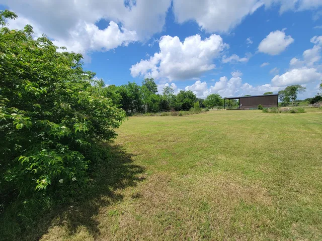 a view of an ocean and a yard