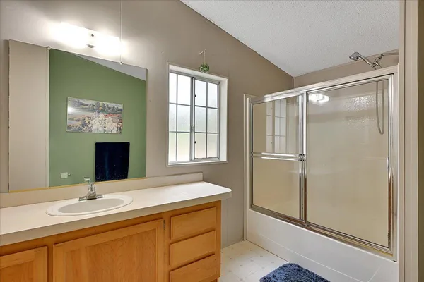 a bathroom with a double vanity sink and mirror