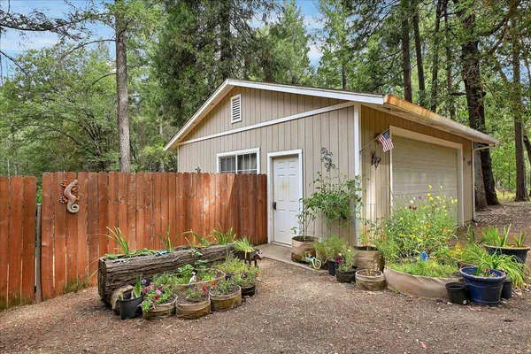 a wooden bench sitting in front of a house