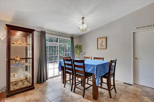 a view of a dining room with furniture window and outside view