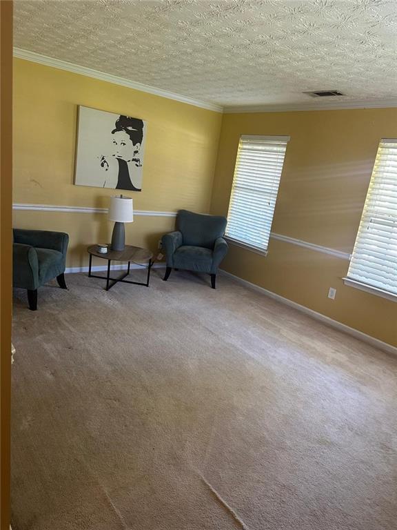 928 Shannon Road Southwest Loganville, GA 30052 - Photo 1 of 16 a living room with furniture and a window