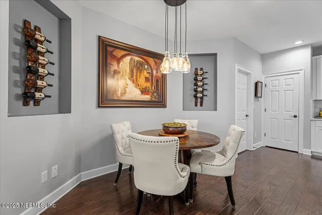 a living room with furniture and a ceiling fan