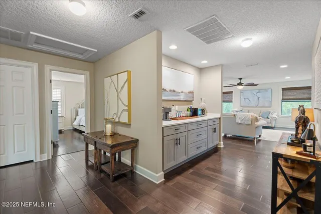 a very nice looking dining room with furniture window and wooden floor