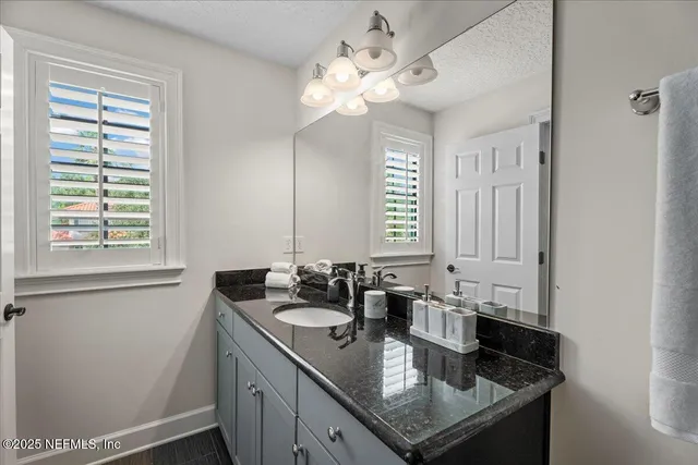 an aerial view of a house with outdoor space patio and outdoor seating