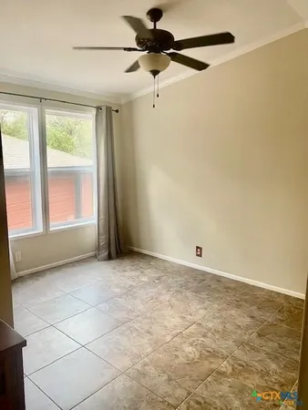 a view of an empty room with a window