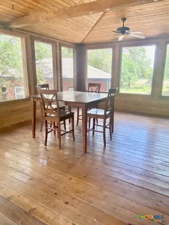 a dining room with furniture window wooden floor