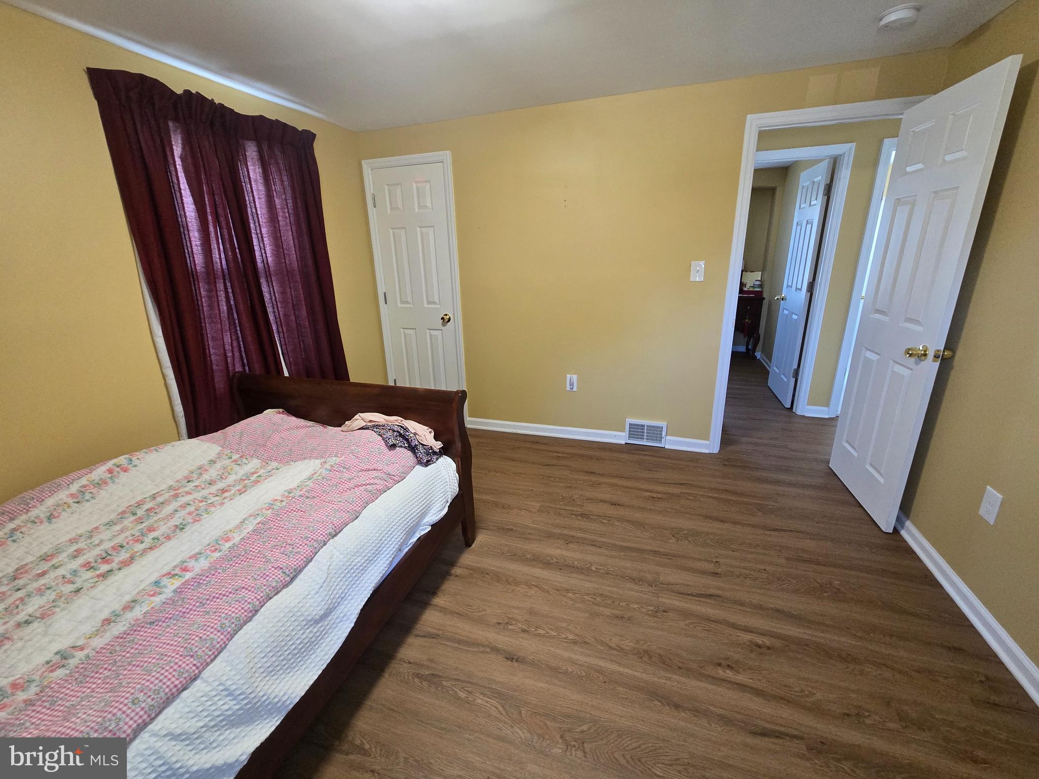 194 Atlantic Avenue Hamilton, NJ 08609 - Photo 11 of 43 a bedroom with a bed and a mirror