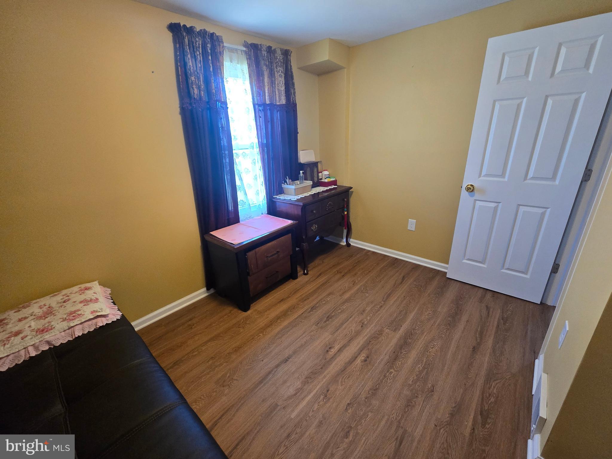 194 Atlantic Avenue Hamilton, NJ 08609 - Photo 14 of 43 a bedroom with a bed and wooden floor