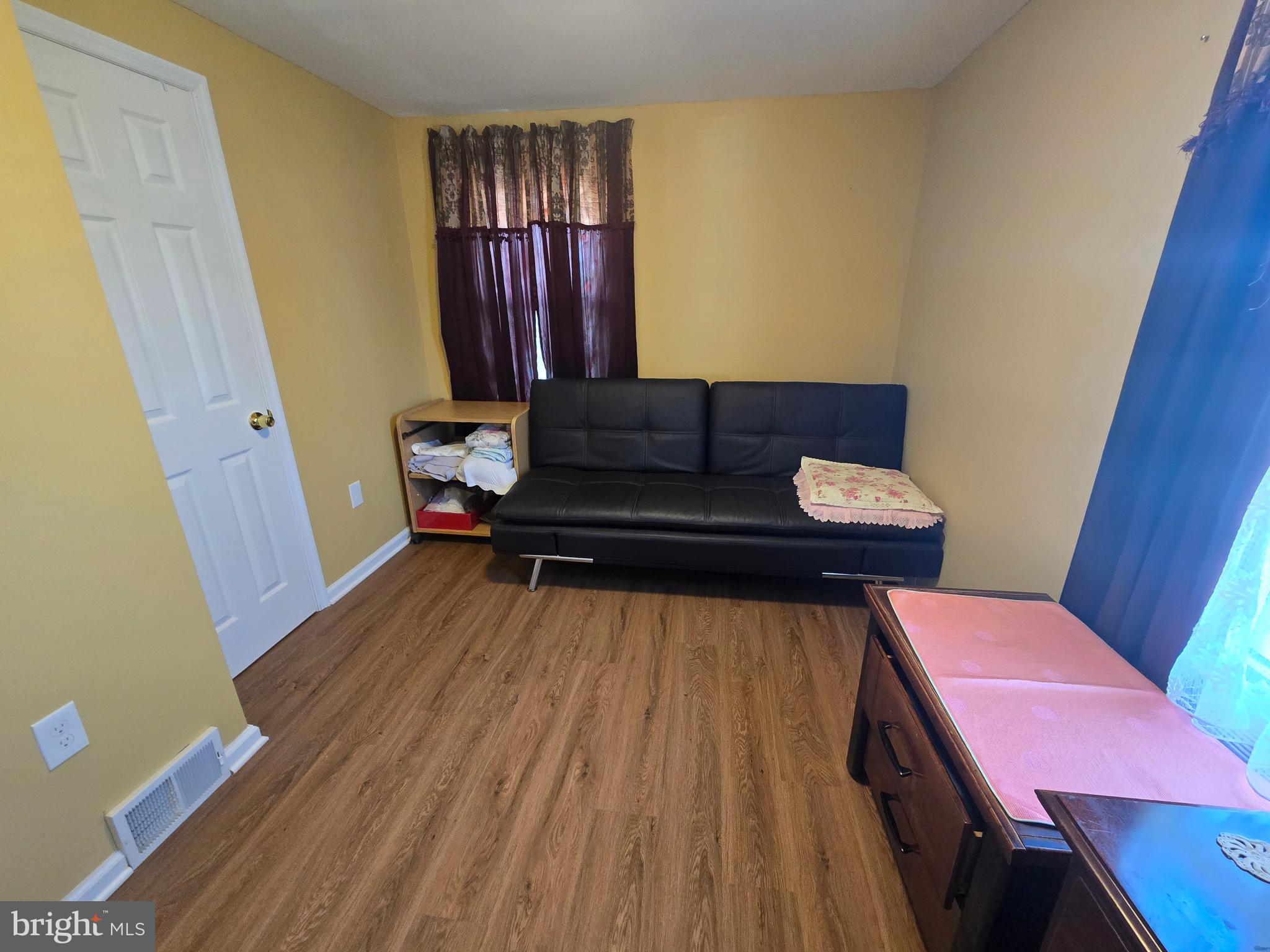 194 Atlantic Avenue Hamilton, NJ 08609 - Photo 15 of 43 a living room with furniture and a wooden floor