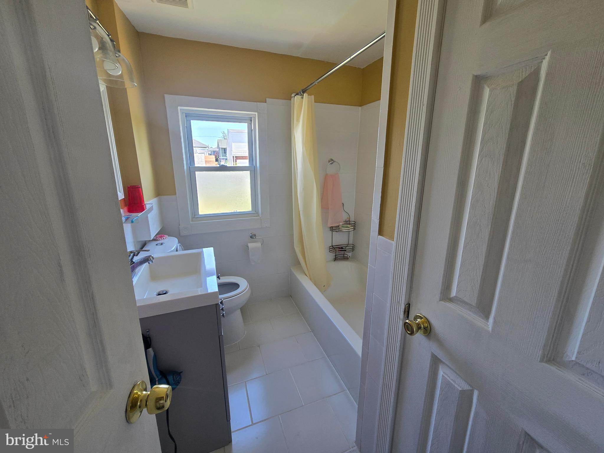 194 Atlantic Avenue Hamilton, NJ 08609 - Photo 18 of 43 a bathroom with sink and mirror
