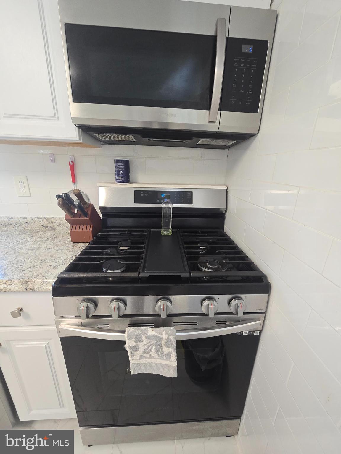 194 Atlantic Avenue Hamilton, NJ 08609 - Photo 42 of 43 a stove top oven sitting inside of a kitchen