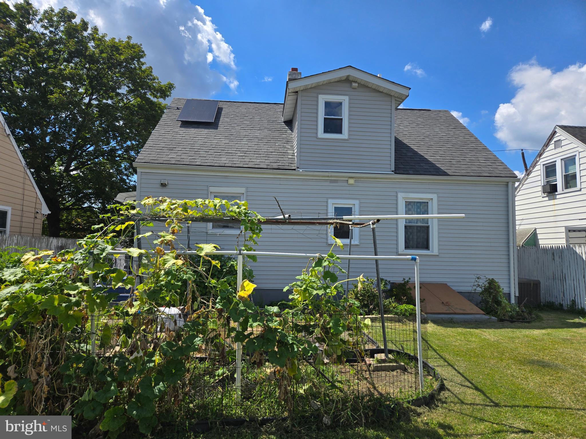 194 Atlantic Avenue Hamilton, NJ 08609 - Photo 7 of 43 a front view of a house with a yard
