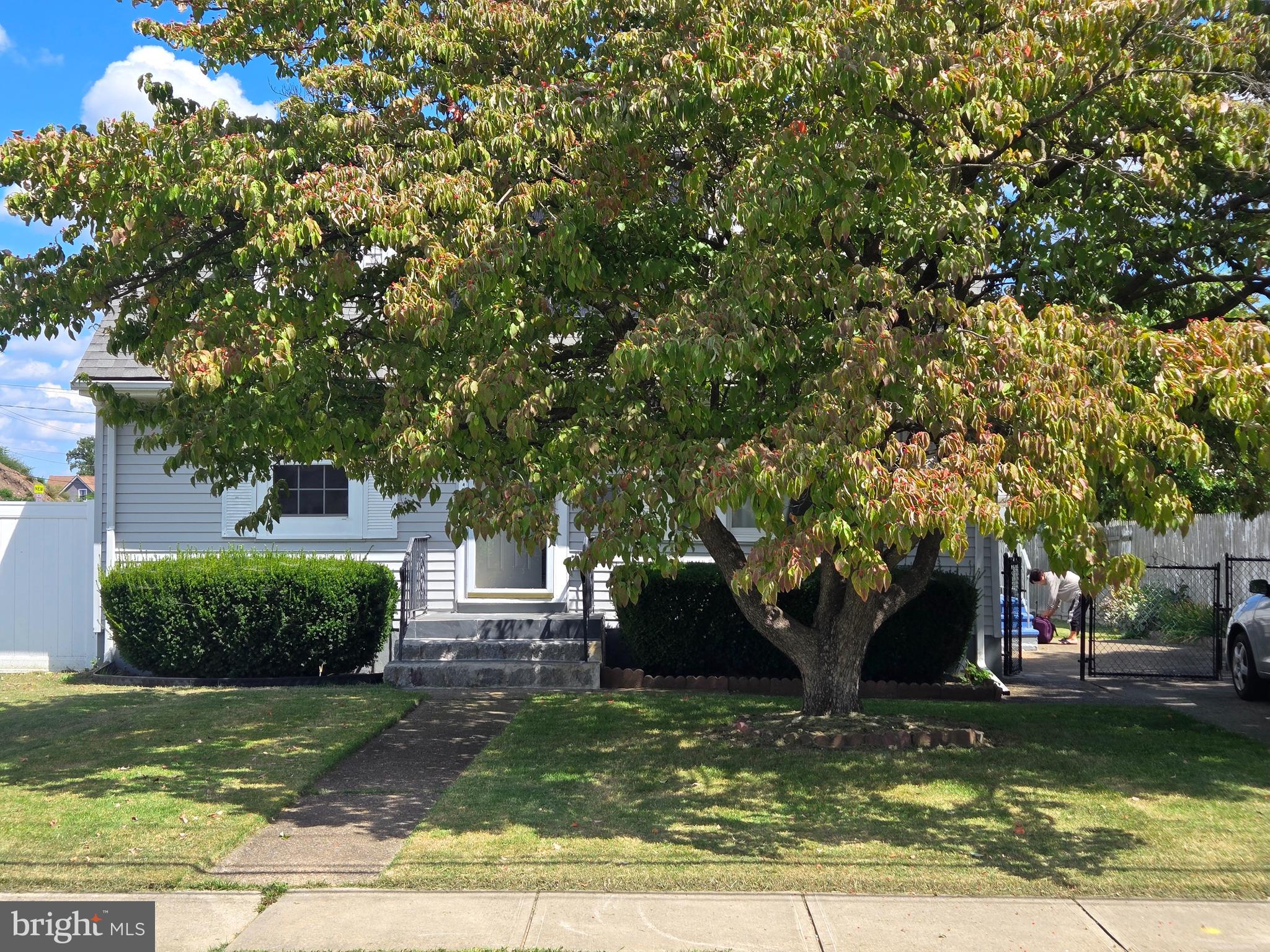 194 Atlantic Avenue Hamilton, NJ 08609 - Photo 8 of 43 a front view of a house with a yard
