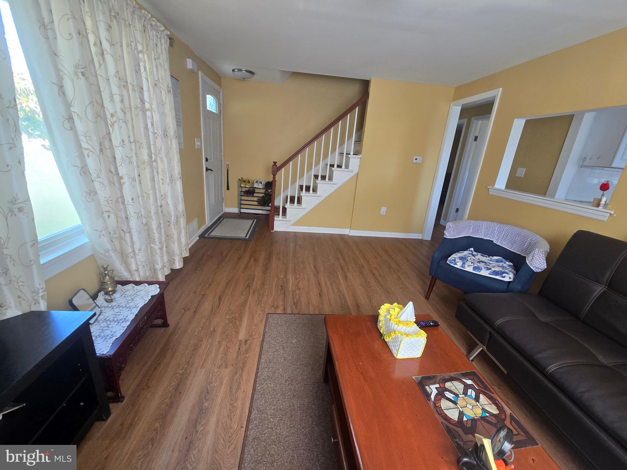 194 Atlantic Avenue Hamilton, NJ 08609 - Photo 10 of 43 a living room with furniture and a wooden floor