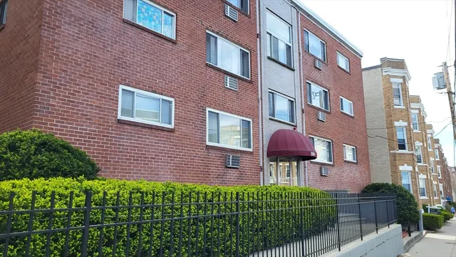 a red brick building with glass windows