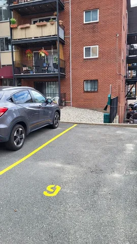 a car parked in front of a building