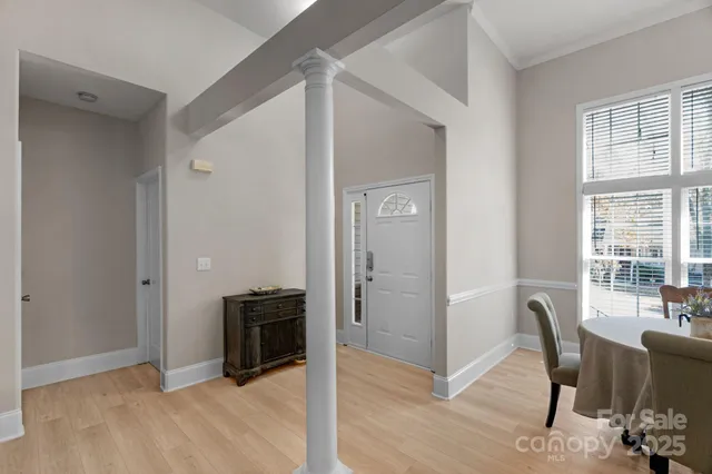 a view of a livingroom with furniture and a window