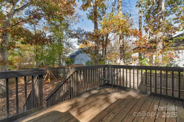 a view of balcony with wooden floor