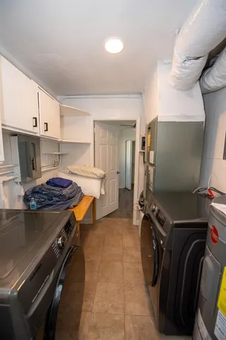 a kitchen with a stove and a refrigerator