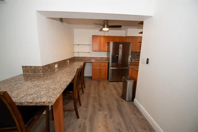 a kitchen with a refrigerator and countertop
