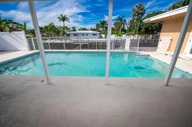 an aerial view of a house with a yard and garden
