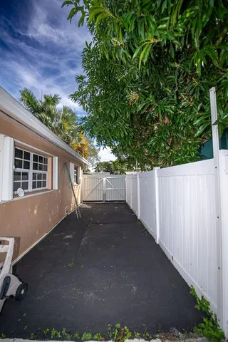 an aerial view of house with yard swimming pool and outdoor seating