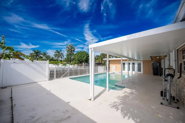 an aerial view of house with yard