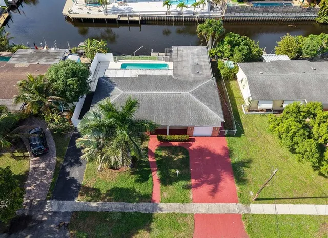 an aerial view of residential houses with outdoor space