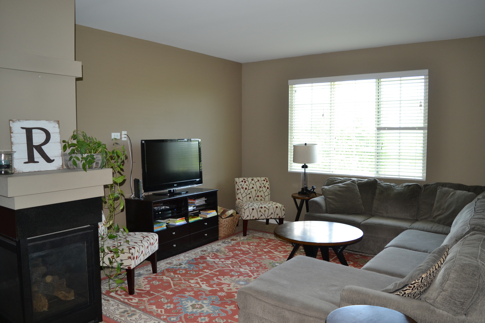 3372 Cameron Drive Elgin, IL 60124 - Photo 3 of 18 a living room with furniture and a flat screen tv