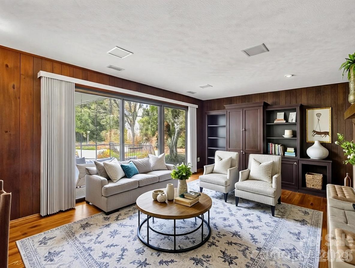 1867 Fruitland Road Hendersonville, NC 28792 - Photo 16 of 47 a living room with furniture a rug and a large window