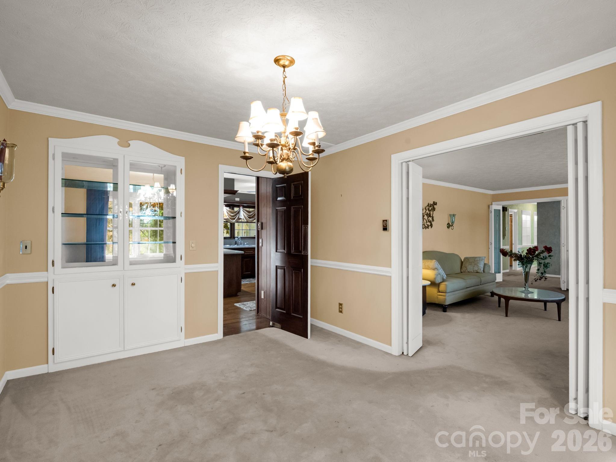1867 Fruitland Road Hendersonville, NC 28792 - Photo 19 of 45 a view of a livingroom with furniture cabinet and front door
