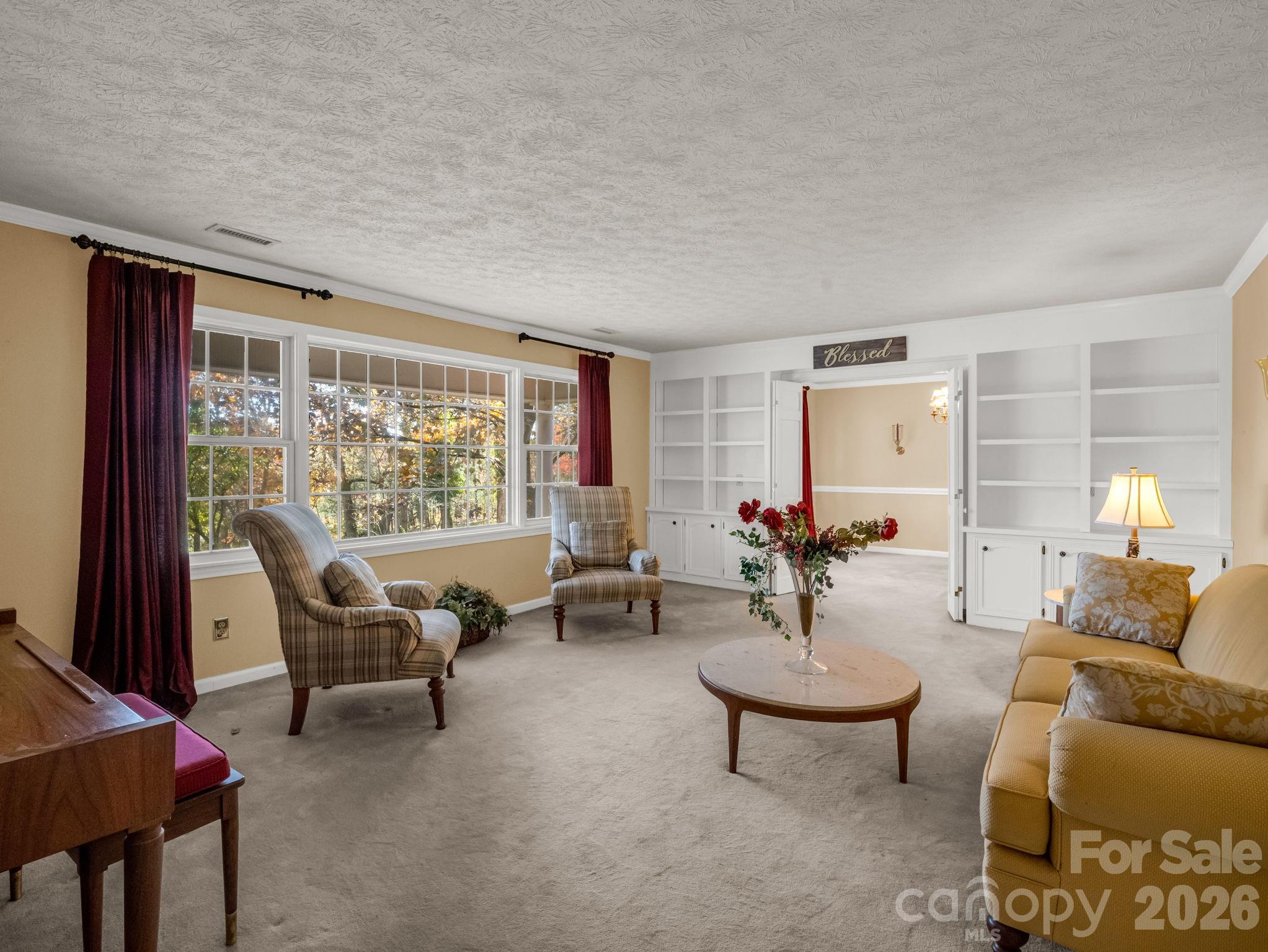 1867 Fruitland Road Hendersonville, NC 28792 - Photo 20 of 45 a living room with furniture and a large window
