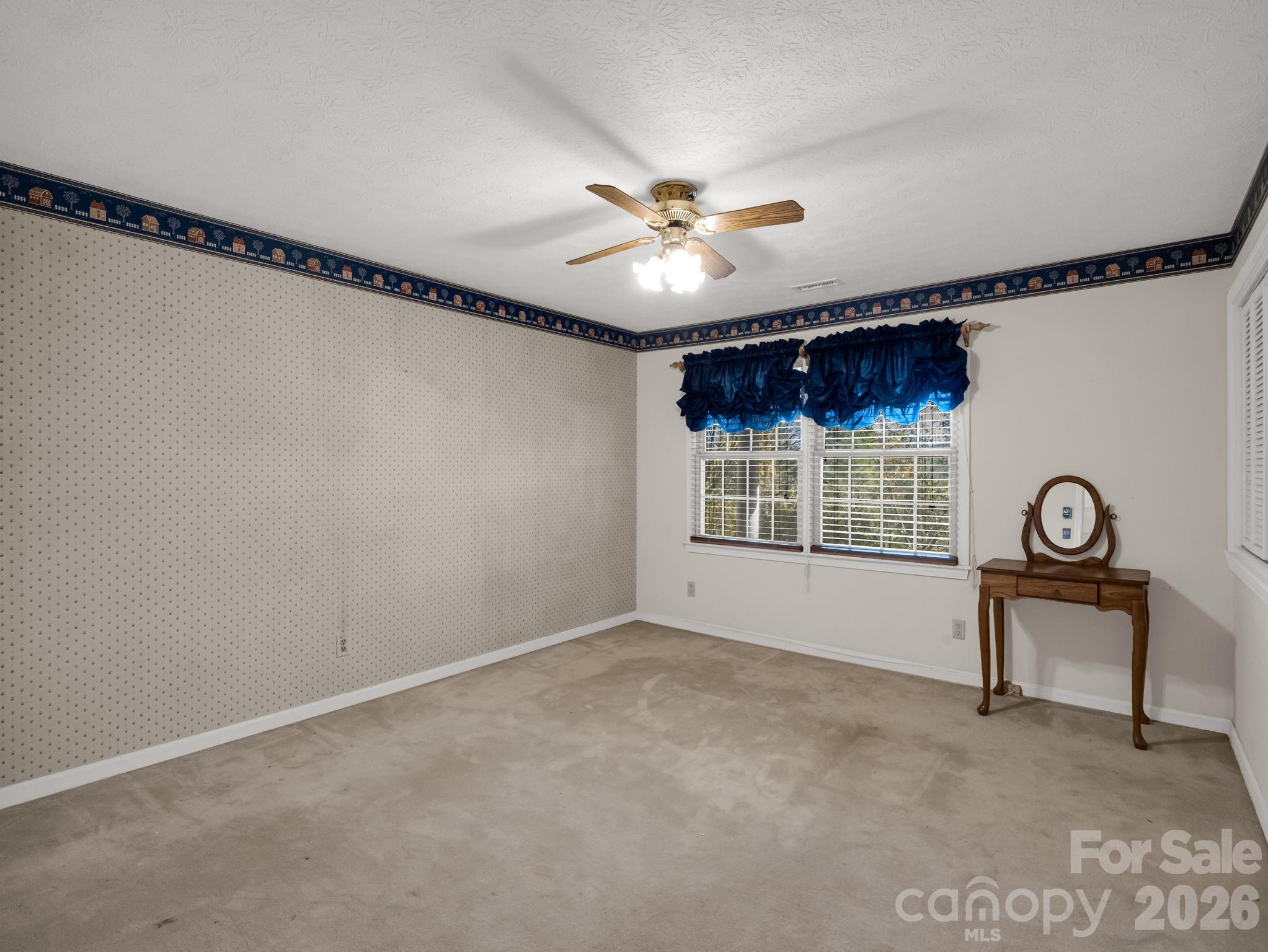 1867 Fruitland Road Hendersonville, NC 28792 - Photo 23 of 45 a view of an empty room with a window