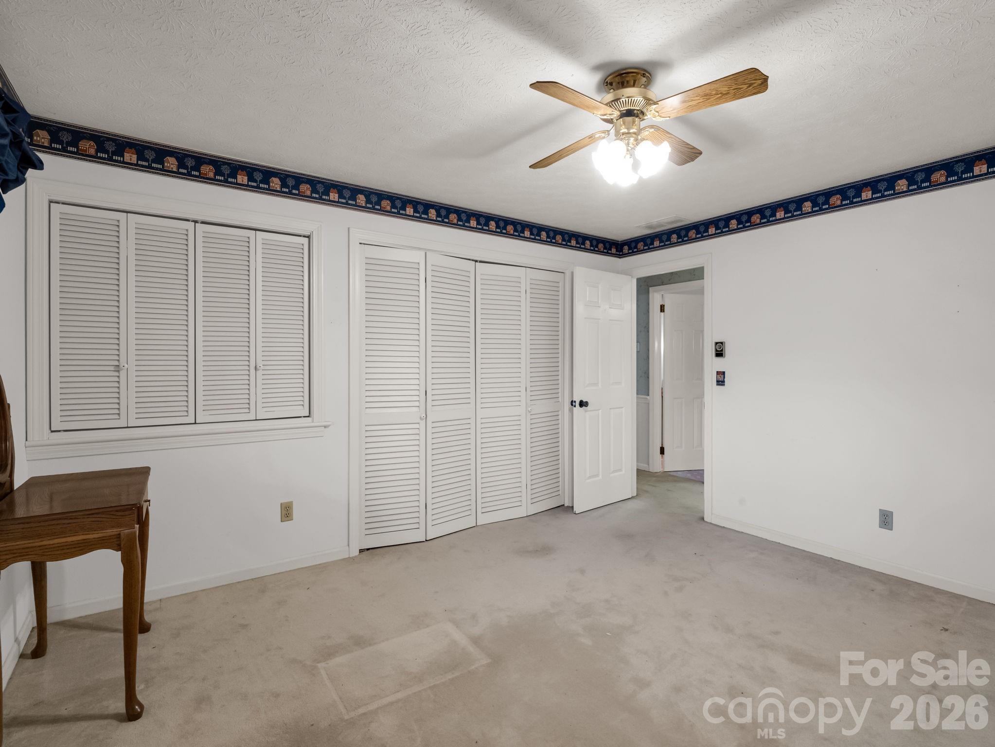 1867 Fruitland Road Hendersonville, NC 28792 - Photo 24 of 45 a view of an empty room with a window