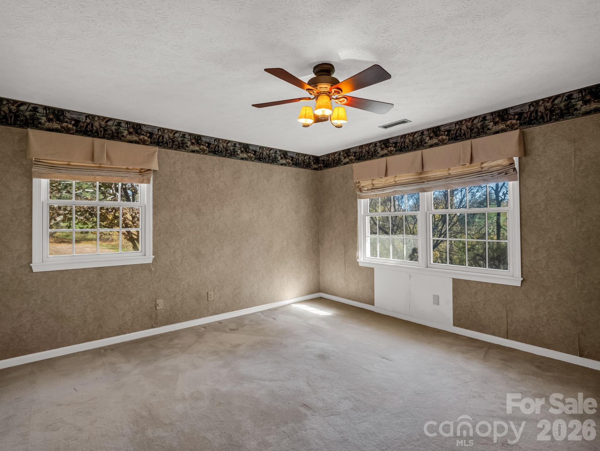 1867 Fruitland Road Hendersonville, NC 28792 - Photo 24 of 47 a view of an empty room with a window
