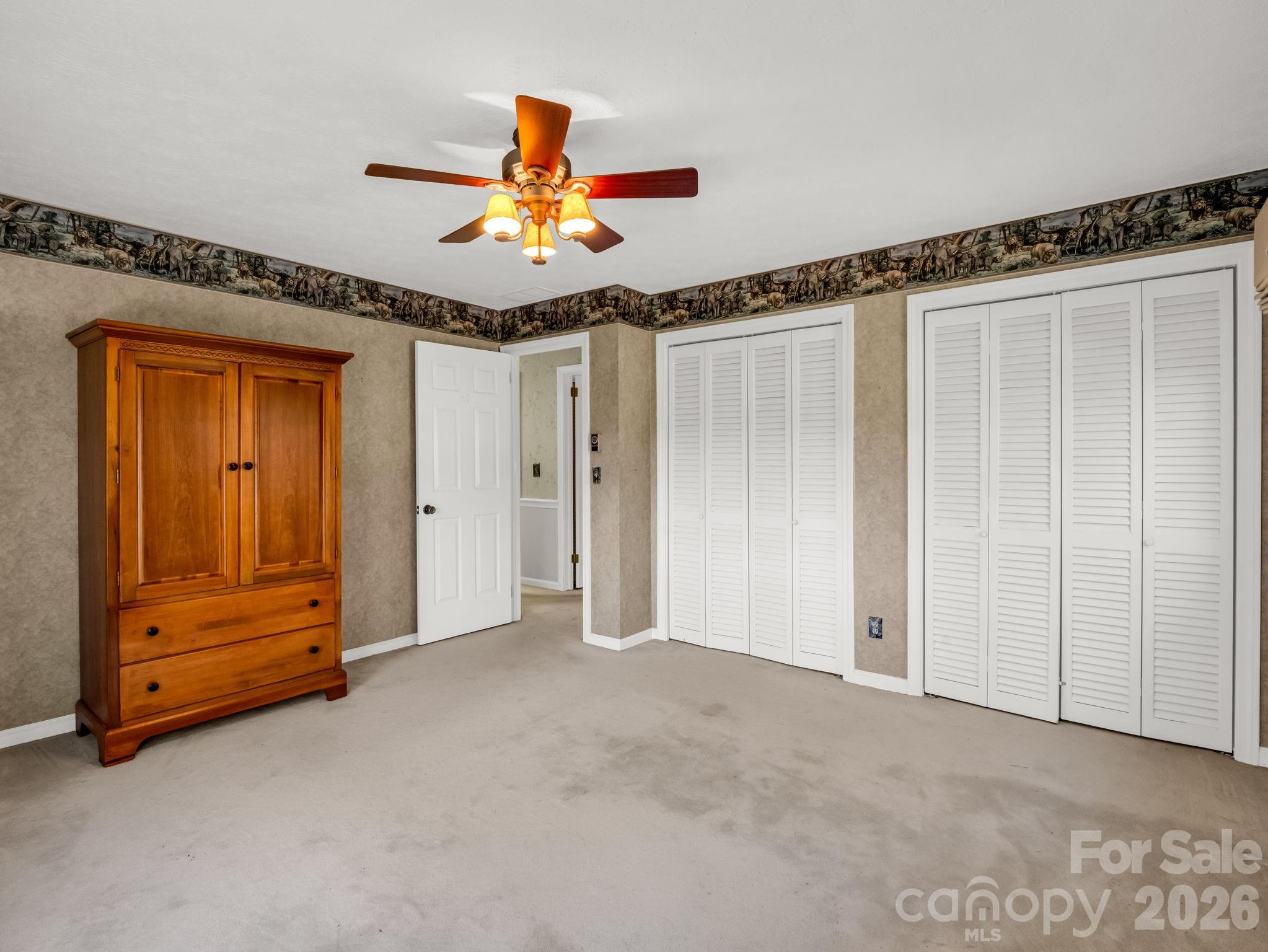 1867 Fruitland Road Hendersonville, NC 28792 - Photo 26 of 45 a view of an empty room with a ceiling fan