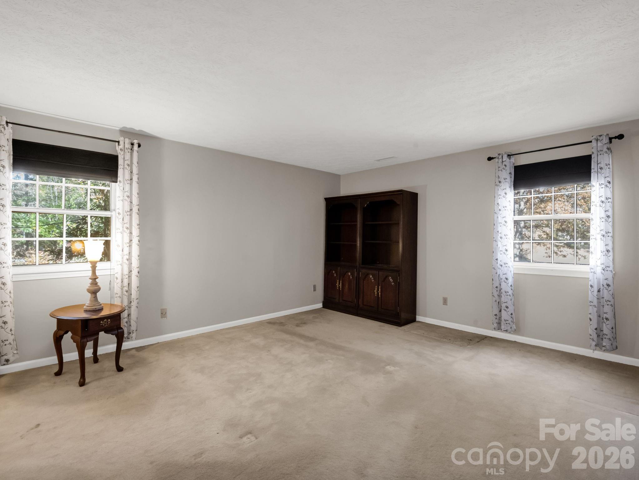 1867 Fruitland Road Hendersonville, NC 28792 - Photo 28 of 47 an empty room with windows