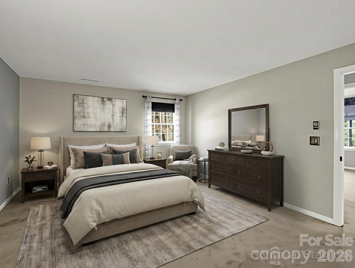 1867 Fruitland Road Hendersonville, NC 28792 - Photo 29 of 47 a bedroom with a bed and a couch