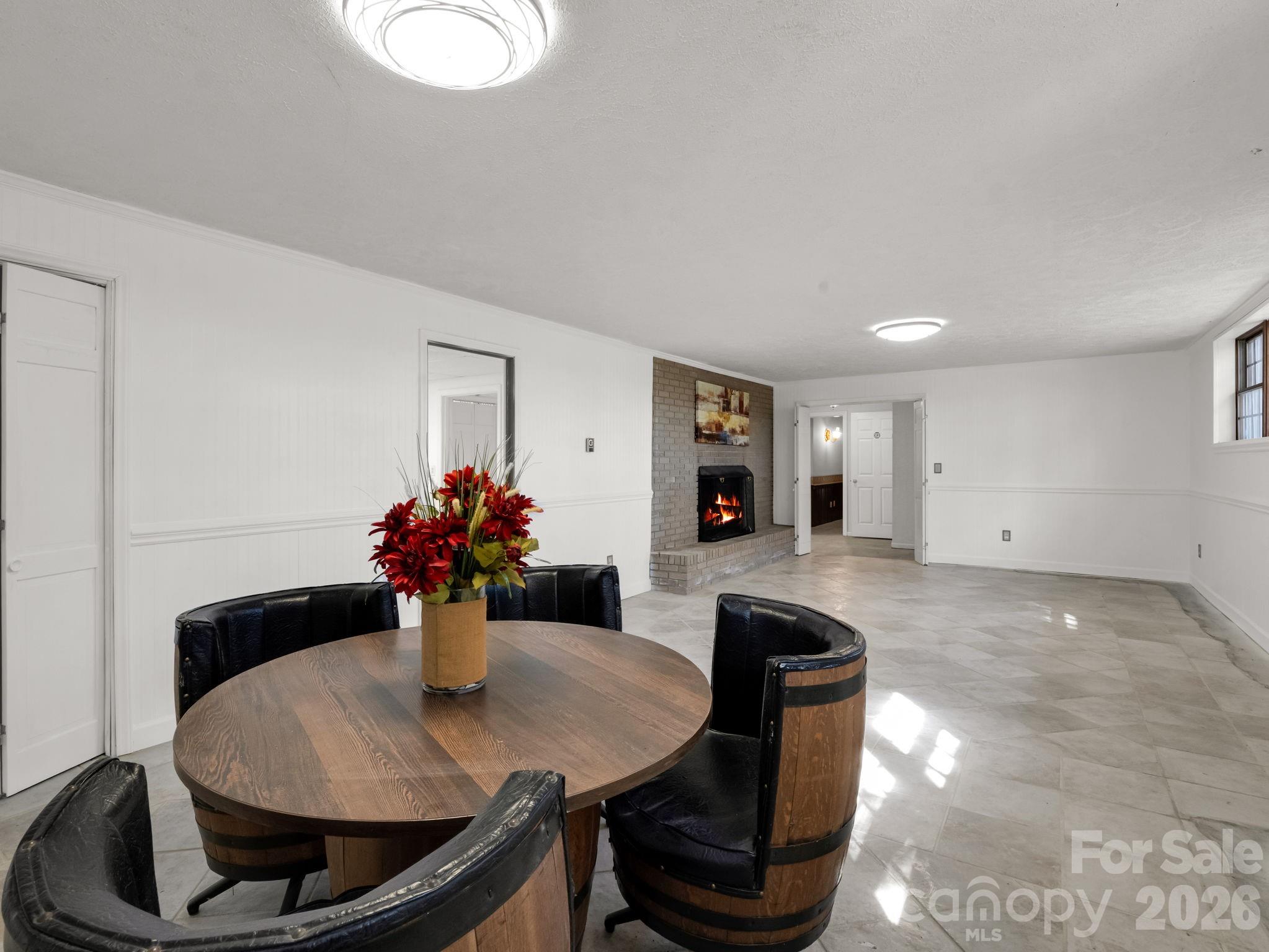 1867 Fruitland Road Hendersonville, NC 28792 - Photo 35 of 47 a dining room with furniture and wooden floor