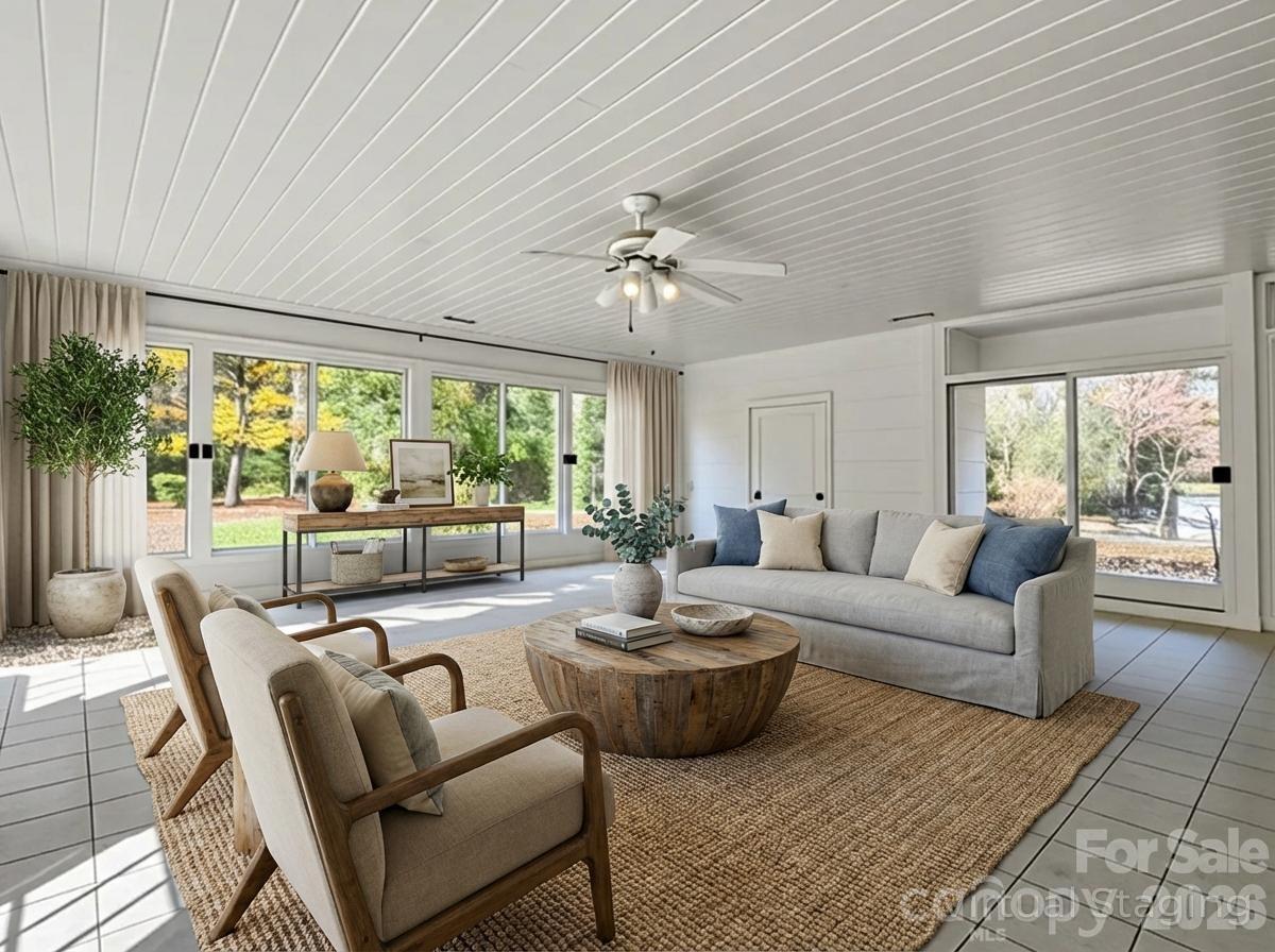 1867 Fruitland Road Hendersonville, NC 28792 - Photo 8 of 47 a living room with furniture and a large window