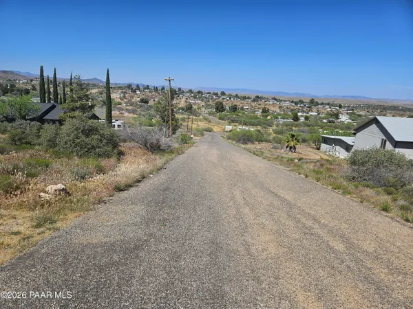 a view of a beach with a building in the background