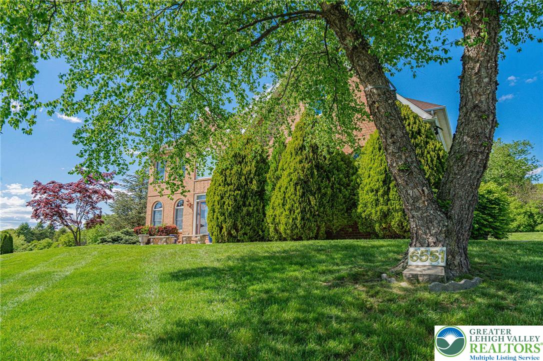6551 Overlook Road Orefield, PA 18069 - Photo 10 of 82 a front view of a house with garden