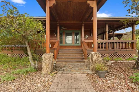 a view of a balcony with wooden floor