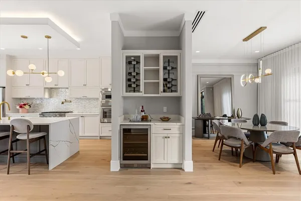 a kitchen with cabinets and stainless steel appliances