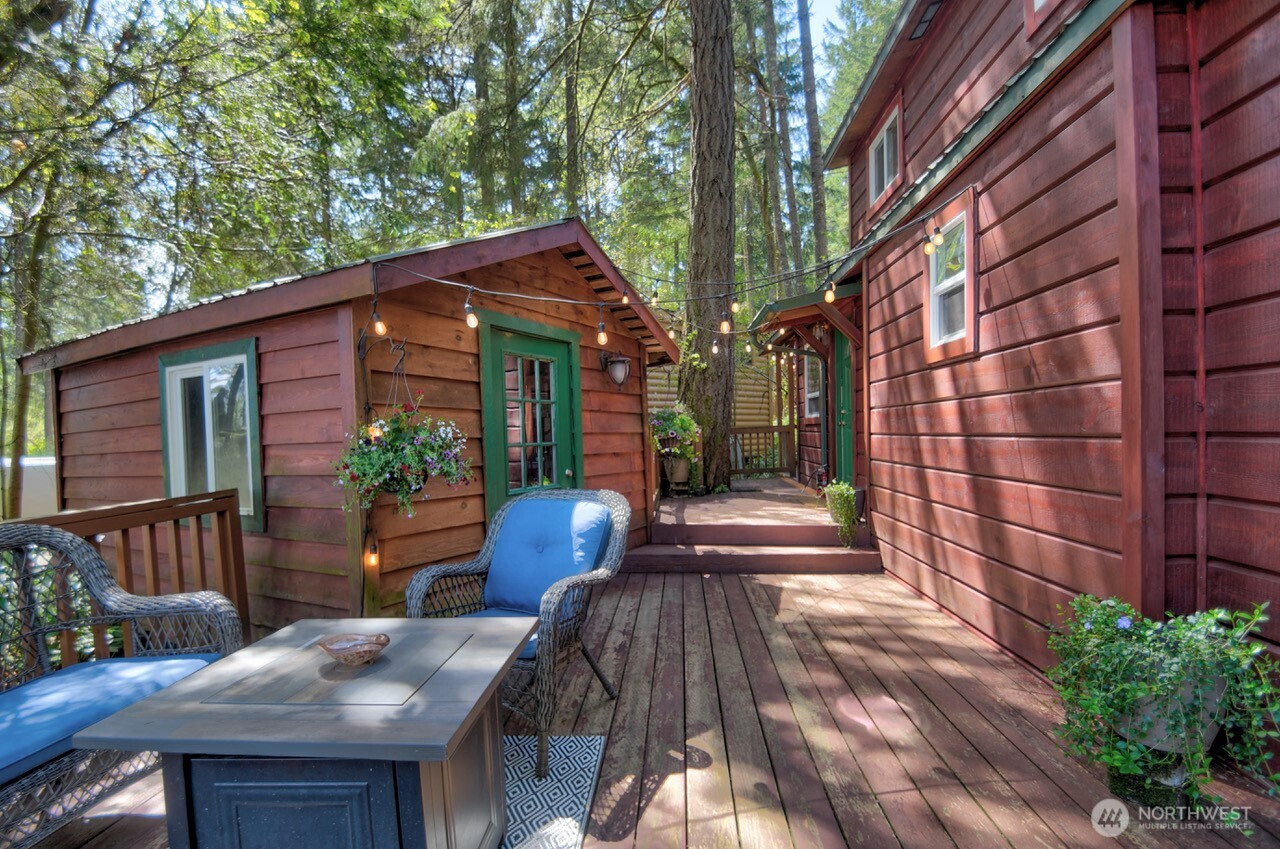 1546 Reservation Road Southeast, Unit 264 Olympia, WA 98513 - Photo 6 of 40 a view of house with a chairs and table in the patio