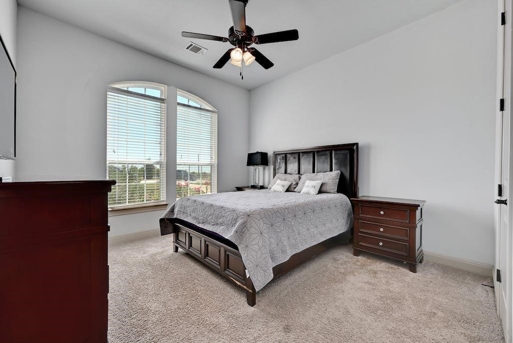 7300 Gilbert Road Manor, TX 78653 - Photo 26 of 40 a bedroom with a bed and a window
