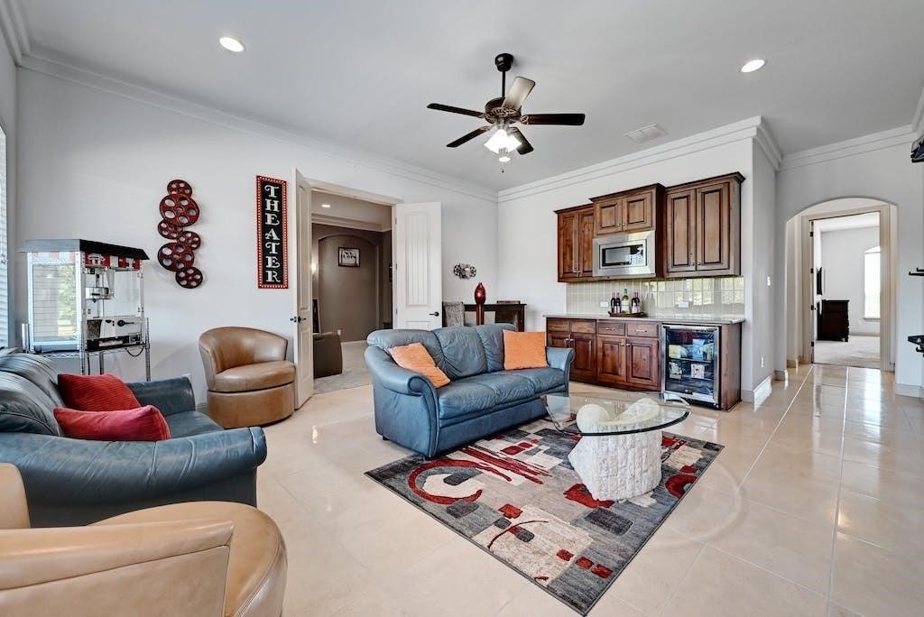 7300 Gilbert Road Manor, TX 78653 - Photo 29 of 40 a living room with furniture and a flat screen tv