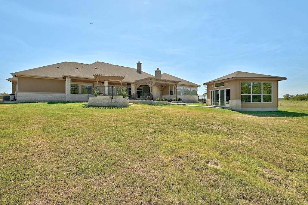 7300 Gilbert Road Manor, TX 78653 - Photo 36 of 40 a large house with a large pool