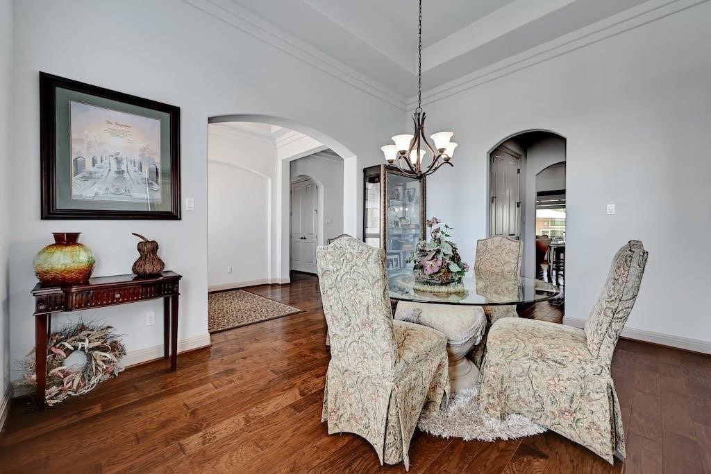 7300 Gilbert Road Manor, TX 78653 - Photo 9 of 40 a view of a dining room with furniture and wooden floor