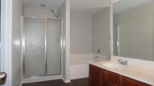 a bathroom with a double vanity sink and mirror